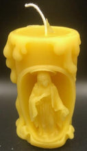 Load image into Gallery viewer, These beautifully detailed Religious Candles depict four different bible scenes - Jesus on the cross, the Virgin Mary, the Holy Family & the Nativity manger scene.  Bring the spirit of Christ into your home with these gorgeous beeswax candles.  They make fantastic gifts, are great for Christmas decor, housewarming gifts, holiday centerpieces and alters.  Available in purple, blue or natural yellow beeswax.  **** Please note desired color when ordering.