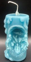 Load image into Gallery viewer, These beautifully detailed Religious Candles depict four different bible scenes - Jesus on the cross, the Virgin Mary, the Holy Family & the Nativity manger scene.  Bring the spirit of Christ into your home with these gorgeous beeswax candles.  They make fantastic gifts, are great for Christmas decor, housewarming gifts, holiday centerpieces and alters.  Available in purple, blue or natural yellow beeswax.  **** Please note desired color when ordering.