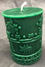 Load image into Gallery viewer, A great addition to any holiday decor, this Christmas Beeswax Pillar Candle is decorated with snowflakes, Christmas trees and cute little moose.  Makes a wonderful gift, addition to your Christmas decor, or as a centerpiece.  Available in red, green or natural yellow beeswax.