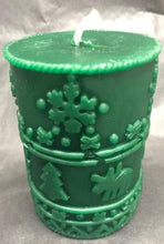 Load image into Gallery viewer, A great addition to any holiday decor, this Christmas Beeswax Pillar Candle is decorated with snowflakes, Christmas trees and cute little moose.  Makes a wonderful gift, addition to your Christmas decor, or as a centerpiece.  Available in red, green or natural yellow beeswax.