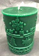 Load image into Gallery viewer, A great addition to any holiday decor, this Christmas Beeswax Pillar Candle is decorated with snowflakes, Christmas trees and cute little moose.  Makes a wonderful gift, addition to your Christmas decor, or as a centerpiece.  Available in red, green or natural yellow beeswax.