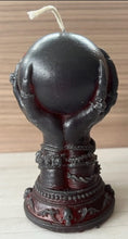 Load image into Gallery viewer, Our Witch Holding a Crystal Ball Beeswax Candle is an enchanting addition to any witchy, gothic or Halloween decor! The intricate detailing around the base of the candle features decorative skulls. The witch hand is adorned with bracelets, rings & long, sharp fingernails adding to the eerie vibe of this incredible beeswax candle.