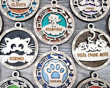 Load image into Gallery viewer, Share the love for our furry friends with these beautiful cat ornaments!  7 different options available.  Send us the name you'd like personalized on it & we'll add it to your ornament.  Please let us know if you'd like a certain background color