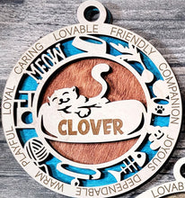 Load image into Gallery viewer, Share the love for our furry friends with these beautiful cat ornaments! 7 different options available. Send us the name you'd like personalized on it & we'll add it to your ornament. Please let us know if you'd like a certain background color