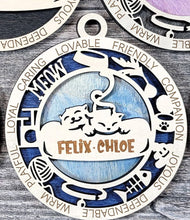 Load image into Gallery viewer, Share the love for our furry friends with these beautiful cat ornaments! 7 different options available. Send us the name you'd like personalized on it & we'll add it to your ornament. Please let us know if you'd like a certain background color