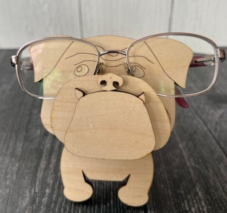 Let his adorable little dog keep your eyeglasses safe while you sleep.  Glasses rest across the dog's nose.  These Eyeglass holders are a MUST for children & adults alike.  Keep your glasses safe from scratches.  Also makes a great gift!