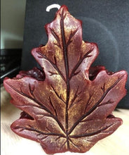 Load image into Gallery viewer, Get ready for the leaves changing colors & crisp fall days with this beautiful Fall Leaves Beeswax Candle.  Adds a beautiful touch to centerpieces, Thanksgiving decor or Halloween decor.  Available in orange, burgundy or yellow with a sparkly center.