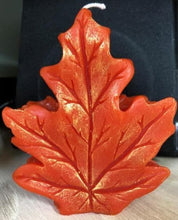 Load image into Gallery viewer, Get ready for the leaves changing colors & crisp fall days with this beautiful Fall Leaves Beeswax Candle.  Adds a beautiful touch to centerpieces, Thanksgiving decor or Halloween decor.  Available in orange, burgundy or yellow with a sparkly center.