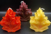 Load image into Gallery viewer, Get ready for the leaves changing colors & crisp fall days with this beautiful Fall Leaves Beeswax Candle.  Adds a beautiful touch to centerpieces, Thanksgiving decor or Halloween decor.  Available in orange, burgundy or yellow with a sparkly center.
