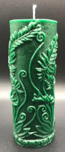 Load image into Gallery viewer, Elegant all natural beeswax pillar candle with fern leaves and fiddleheads adorning the sides. Handmade in the USA. Green shown. Also available in natural yellow beeswax.
