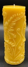 Load image into Gallery viewer, Elegant all natural beeswax pillar candle with fern leaves and fiddleheads adorning the sides. Handmade in the USA.