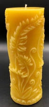 Load image into Gallery viewer, Elegant all natural beeswax pillar candle with fern leaves and fiddleheads adorning the sides. Handmade in the USA.