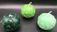 Load image into Gallery viewer, Elegant fern fronds & vines twist and curl to adorn this beautiful ball candle. An impressive option to use as a housewarming gift, birthday gift, anniversary gift, godmother gift, for Mother's Day gift, Christmas gift or as a thank you gift. Relax and unwind while enjoying the ambiance and subtle sweet aroma of this gorgeous fern beeswax ball candle. 3 varieties of green fern beeswax ball candles shown.  Top view.