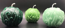 Load image into Gallery viewer, Elegant fern fronds & vines twist and curl to adorn this beautiful ball candle. An impressive option to use as a housewarming gift, birthday gift, anniversary gift, godmother gift, for Mother's Day gift, Christmas gift or as a thank you gift.  Relax and unwind while enjoying the ambiance and subtle sweet aroma of this gorgeous fern beeswax ball candle.  3 varieties of green fern beeswax ball candles shown.