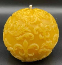 Load image into Gallery viewer, Fleur de lis designs adorn this all natural beeswax ball candle. Handmade in the USA.