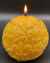 Load image into Gallery viewer, Fleur de lis designs adorn this all natural beeswax ball candle. Handmade in the USA.