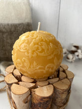 Load image into Gallery viewer, This beautiful sphere Fleur De Lis beeswax candle is a great addition to a dining room table or an entryway and can make a fantastic gift for anyone who loves the New Orleans Saints or is of French ancestry. The soft light of the beeswax illuminates the Fleur De Lis design beautifully as it lights up your room. Available in natural, purple or green.