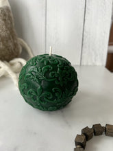 Load image into Gallery viewer, This beautiful sphere Fleur De Lis beeswax candle is a great addition to a dining room table or an entryway and can make a fantastic gift for anyone who loves the New Orleans Saints or is of French ancestry. The soft light of the beeswax illuminates the Fleur De Lis design beautifully as it lights up your room. Available in natural, purple or green.