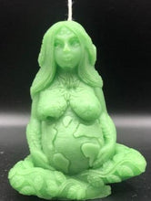Load image into Gallery viewer, Gaia Mother Earth Beeswax Candle.  Our beautifully detailed Gaia / Mother Earth Beeswax Candle brings a bit of nature’s beauty into our homes & reminds us to be grateful for all that nature gives us.  She holds the Earth in her hands with stars and the sun above, the plants decorate her limbs, and the infinity symbol decorates her forehead (third eye).   A wonderful gift for nature lovers or to include with meditation practices.