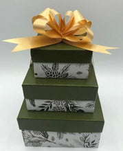Load image into Gallery viewer, Small gift box trio. Set of 3 gift boxes stacked & tied with a bow. Set includes a beeswax candle, body butter, and a lotion bar. All wrapped & ready to give to your loved ones.