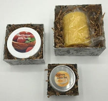 Load image into Gallery viewer, Small gift box trio. Set of 3 gift boxes stacked & tied with a bow. Set includes a beeswax candle, body butter, and a lotion bar. All wrapped & ready to give to your loved ones.