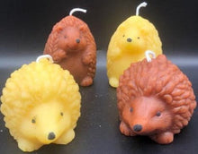 Load image into Gallery viewer, What could be cuter than a Hedgehog Beeswax Candle? Two! We offer these adorable Hedgehog Beeswax Candles standing upright or on the ground. This very detailed candle is sure to delight the hedgehog lovers in your life. Great for birthday gifts, fall decorating, housewarming gifts or Christmas gifts.