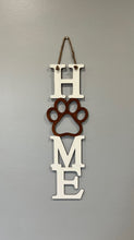 Load image into Gallery viewer, Welcome everyone (especially the fur babies) into your home with this adorable sign!  The purr-fect gift for your pet loving friends & loved ones!      Approximately 19” long x 6” wide (not including hanging rope)