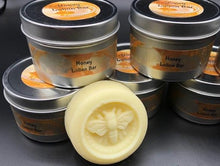 Load image into Gallery viewer, Adorable beeswax and honey lotion bar in a honey bee shape. Handmade in the USA. These handy lotion bars are great when you're on the go or for everyday use! Natural body heat slightly melts a bit of the lotion onto your hands. Great for elbows and dry areas. It leaves your skin feeling smooth and hydrated. The beeswax adds a barrier of protection that keeps the lotion where you put it longer. Great for Valentine's Day gifts, bridal party gifts, bridal showers, baby showers, or gifts for friends.