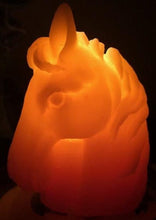 Load image into Gallery viewer, Horse design surrounds this all natural beeswax candle. Horse head on the front and wild horses running on the back side of the candle. Handmade in the USA.