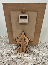 Load image into Gallery viewer, Beautiful Hummingbird layered photo frame with hearts hanging down that you have engraved with your family's names. Hummingbirds & a tree design decorate the outside border of this frame in white, with a cherry wood background. The frame can also have a custom banner added at the bottom with a date, family name, or a quote. The perfect gift for weddings, anniversaries, baby showers, or birthdays. Personalize with up to 20 different names.