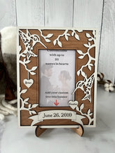 Load image into Gallery viewer, This Hummingbird Photo Frame is the perfect way to display your cherished memories with loved ones.  This unique and personalized photo frame can be customized with up to 20 names in the hearts hung around the frame and custom wording in the banner across the bottom, making it a special and meaningful addition to any home decor.  Available for a 4" x 6" or a 5" x 7" photo.