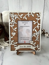 Load image into Gallery viewer, This Hummingbird Photo Frame is the perfect way to display your cherished memories with loved ones.  This unique and personalized photo frame can be customized with up to 20 names in the hearts hung around the frame and custom wording in the banner across the bottom, making it a special and meaningful addition to any home decor.  Available for a 4" x 6" or a 5" x 7" photo.