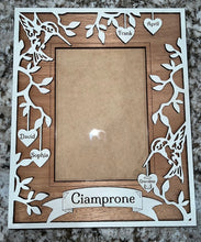 Load image into Gallery viewer, Beautiful Hummingbird layered photo frame with hearts hanging down that you have engraved with your family's names. Hummingbirds & a tree design decorate the outside border of this frame in white, with a cherry wood background. The frame can also have a custom banner added at the bottom with a date, family name, or a quote. The perfect gift for weddings, anniversaries, baby showers, or birthdays. Personalize with up to 20 different names.