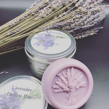 Load image into Gallery viewer, Lavender themed gift basket all ready to deliver to your loved ones. Basket includes a body butter, a lotion bar, a bath bomb, an all natural beeswax candle (unscented) & a soap bar. An additional body butter or bath product can be substituted for the candle. Handmade in the USA.