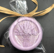 Load image into Gallery viewer, Lavender themed gift basket all ready to deliver to your loved ones. Basket includes a body butter, a lotion bar, a bath bomb, an all natural beeswax candle (unscented) & a soap bar. An additional body butter or bath product can be substituted for the candle. Handmade in the USA.