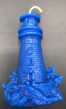 Load image into Gallery viewer, This Lighthouse beeswax candle takes you back to the sea & promises to bring images of the seashore to your dreams.  Perfect for nautical or coastal themed decor or as a gift to the beach lover in your life.  Allow this stunning candle to envelop your room in a warm glow with a sweet honey aroma.  Shown in blue.  Also available in natural yellow beeswax.