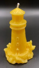Load image into Gallery viewer, Lighthouse design all natural beeswax candle. Handmade in the USA. This Lighthouse beeswax candle takes you back to the sea & promises to bring images of the seashore to your dreams. Perfect for nautical or coastal themed decor or as a gift to the beach lover in your life. Allow this stunning candle to envelop your room in a warm glow with a sweet honey aroma.