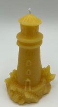 Load image into Gallery viewer, Lighthouse design all natural beeswax candle. Handmade in the USA. This Lighthouse beeswax candle takes you back to the sea & promises to bring images of the seashore to your dreams. Perfect for nautical or coastal themed decor or as a gift to the beach lover in your life. Allow this stunning candle to envelop your room in a warm glow with a sweet honey aroma.
