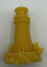 Load image into Gallery viewer, Lighthouse design all natural beeswax candle. Handmade in the USA. This Lighthouse beeswax candle takes you back to the sea & promises to bring images of the seashore to your dreams. Perfect for nautical or coastal themed decor or as a gift to the beach lover in your life. Allow this stunning candle to envelop your room in a warm glow with a sweet honey aroma.