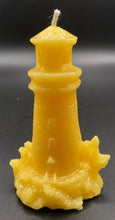 Load image into Gallery viewer, Lighthouse design all natural beeswax candle. Handmade in the USA.  This Lighthouse beeswax candle takes you back to the sea & promises to bring images of the seashore to your dreams.  Perfect for nautical or coastal themed decor or as a gift to the beach lover in your life.  Allow this stunning candle to envelop your room in a warm glow with a sweet honey aroma.