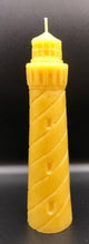 Load image into Gallery viewer, Evoke the beauty of the beach all year long with my 100% beeswax Lighthouse candle. This candle would look great in a nautical themed living space or even a home office. When lit, each candle emits the rich scent of honey and gives off an alluring glow. Perfect as a gift for the beach lover in your life. Bring a bit of the sea to them!