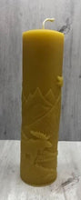Load image into Gallery viewer, Moose nature scene beeswax candle with mountains, leaves, birds, a stream and the wilderness in the background.