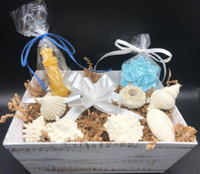 Load image into Gallery viewer, Imagine the soft sand beneath your feet as the soft glow of our beeswax candle relaxes your stresses away.  The lingering scent of our Ocean Breeze Soaps tantalize your senses to make the dream complete.  Our Seaside Gift Basket is sure to impress anyone on your gift list.  Great for birthday gifts, Christmas gifts or just to let someone know you&#39;re thinking of them.
