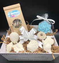 Load image into Gallery viewer,  Wisk your loved one away to the sea with this beach inspired Ocean Breeze Seashell Gift Basket.  Imaging the soothing scent of our Ocean Breeze soaps transporting you right back to the beach with your toes in the sand.  The calming herbs in our Tranquili-Tea will relax your cares away as you dream of days by the ocean.  Ocean Breeze Seashell Gift Basket is packaged and ready to go for your gift giving needs.