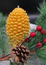 Load image into Gallery viewer, Settle into fall with this pinecone beeswax candle! Made with pure beeswax, this decorative candle makes for perfect fall decor, front porch decor, a housewarming gift, or even a nice choice for some fall wedding decor! Homemade candles are sure to add some charm and create a warm atmosphere in your space. When burned, this candle leaves a wonderful and natural hint of a sweet honey aroma -- completely natural! No fragrance added. Just as nature intended :)