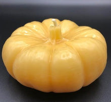 Load image into Gallery viewer, This 100% pure beeswax Pumpkin candle will get you ready for changing leaves, crisp mornings and radiant, crackling fires. Enjoy the sweet natural aroma and gentle glow of a beeswax candle. Make a lovely Thanksgiving or holiday centerpiece display when paired with other natural elements.
