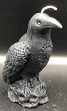 Load image into Gallery viewer, Dark & mysterious, this Raven Beeswax Candle represents a deeper connection between the physical & spiritual world in many cultures. Because of its black plumage, croaking call, and diet of carrion, the raven is often associated with loss and ill omen. Yet, its symbolism is complex. As a talking bird, the raven also represents prophecy and insight. Ravens in stories often act as psychopomps, connecting the material world with the world of spirits.