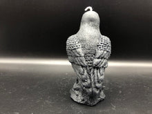 Load image into Gallery viewer, Dark & mysterious, this Raven Beeswax Candle represents a deeper connection between the physical & spiritual world in many cultures. Because of its black plumage, croaking call, and diet of carrion, the raven is often associated with loss and ill omen. Yet, its symbolism is complex. As a talking bird, the raven also represents prophecy and insight. Ravens in stories often act as psychopomps, connecting the material world with the world of spirits.  Back view