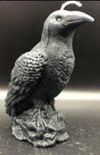 Load image into Gallery viewer, Dark & mysterious, this Raven Beeswax Candle represents a deeper connection between the physical & spiritual world in many cultures.    Because of its black plumage, croaking call, and diet of carrion, the raven is often associated with loss and ill omen. Yet, its symbolism is complex. As a talking bird, the raven also represents prophecy and insight. Ravens in stories often act as psychopomps, connecting the material world with the world of spirits.