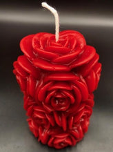 Load image into Gallery viewer, 4 1/4" Rose Beeswax Candle. This beeswax candle is decorated with roses carved into the sides and top of the candle.